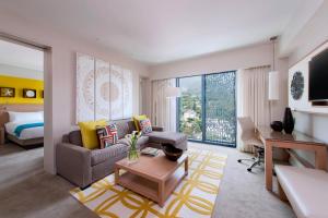 a living room with a couch and a table at Marriott Port-au-Prince Hotel in Port-au-Prince