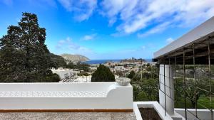 a view of the ocean from the balcony of a house at Villa la Milanina in Lipari