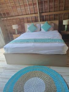 Postel nebo postele na pokoji v ubytování The Lumbung Residence