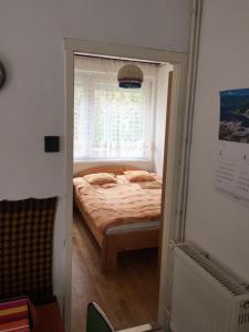 Postel nebo postele na pokoji v ubytování Sirály Apartman