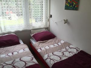 Postel nebo postele na pokoji v ubytování Sirály Apartman