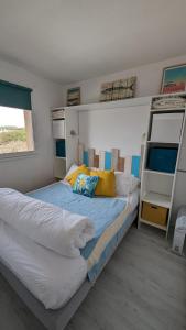 a bedroom with two bunk beds and a ladder at appartement T2 biscarosse plage in Biscarrosse-Plage