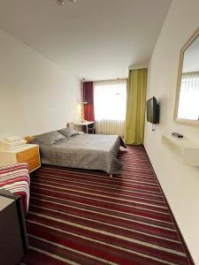Cama o camas de una habitación en Hotel Kalyna