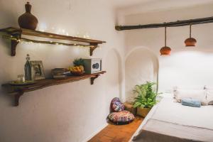 Postel nebo postele na pokoji v ubytování Boho's Hotel