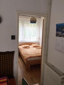 Postel nebo postele na pokoji v ubytování Sirály Apartman