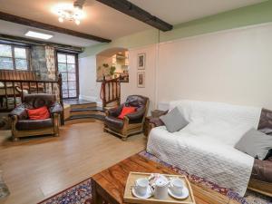 a living room with a couch and chairs at The Searle in Llandrindod Wells