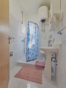a bathroom with a toilet and a sink and a shower at Villa Kipre in Cavtat +34 photos