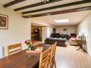 a living room with a table and a couch at The Middleton in Llandrindod Wells