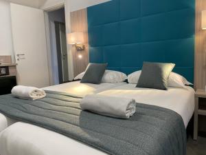 Postel nebo postele na pokoji v ubytování Coccodrillo Hotel & Apartments