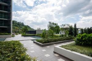 a courtyard with a garden and a building at Liberty Arc Studio 舒适和家温暖的感觉 in Ampang