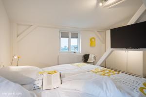 Postel nebo postele na pokoji v ubytování Heimathafen 5 - M S Baltic Star