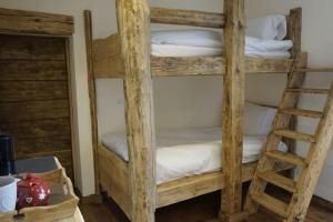 a couple of bunk beds in a room at La Grange de Pimberty - Beautiful apartments 27 miles from Geneva in Vailly