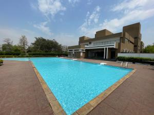 a large swimming pool in front of a building at Samruddhi S1 homestay villa swimming or S3,S20 in Nagpur