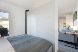 a bedroom with a bed and a desk at Haus Alouette in Dahme