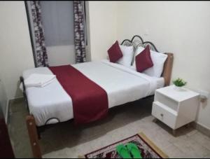 Postel nebo postele na pokoji v ubytování Epic homes + 8 fotografií