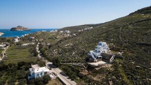 an aerial view of a house on a hill at Theodora in Panormos