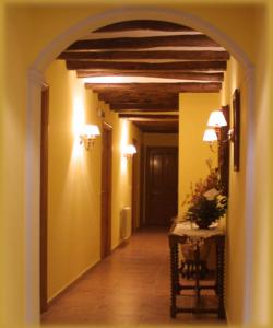 an empty hallway with an archway in a house at CASA RUFAS (Sierra de Guara) in Bierge