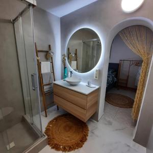 a bathroom with a sink and a mirror at Casa Wens Bénimeit in Moraira