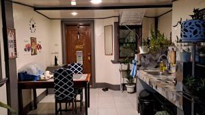Kuchyň nebo kuchyňský kout v ubytování Dalinda's Homestay