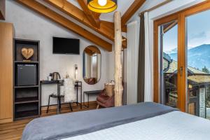 Postel nebo postele na pokoji v ubytování Hotel Folgarida + 37 fotografií