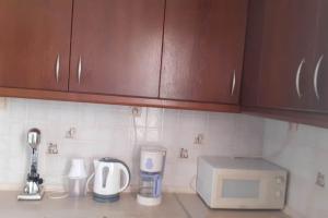 A kitchen or kitchenette at Eirinis home