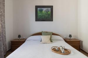 A bed or beds in a room at Casa Marianna by Garda FeWo