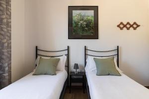 A bed or beds in a room at Casa Marianna by Garda FeWo