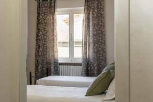 A bed or beds in a room at Casa Marianna by Garda FeWo
