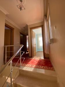 an empty hallway with stairs and a door to a room at Bodrum 3 bedrooms family villa dublex in Bodrum City
