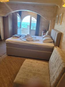 a large bed in a room with a window at Villa Leut Montesol Tivat Krasici in Krasici