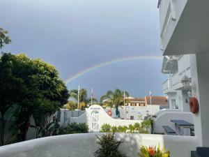 a rainbow over a skate park with a slide at The Joneses in Plettenberg Bay