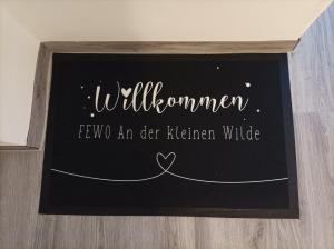 Certifikát, hodnocení, plakát nebo jiný dokument vystavený v ubytování FeWo ,,An der kleinen Wilde''