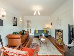 a living room with a couch and a table at Number 3 in Bournemouth