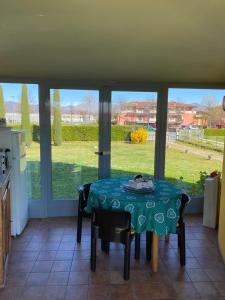 a kitchen with a table with a table cloth on it at I Silos Guest house in Seriate