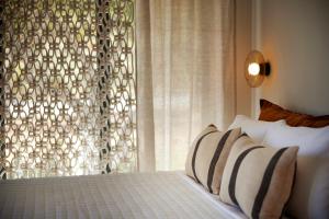 Postel nebo postele na pokoji v ubytování Citrus Grove Luxury Villas