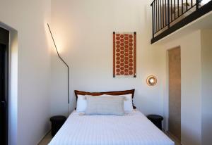 Postel nebo postele na pokoji v ubytování Citrus Grove Luxury Villas