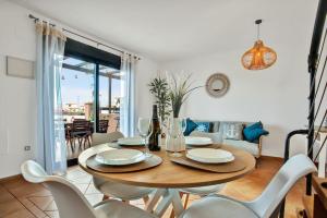 a dining room with a table and chairs at Villa Fénix - Oasis in Natural Reserve in Lajares