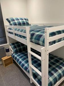 a couple of bunk beds in a room at Trendy 3 Bedroom Home Close To Margate Beaches Bars Resturants 2 Night Min Stay in Kent
