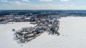 an aerial view of a city in the snow at Capitano in Lahti
