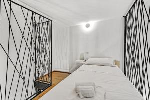 Postel nebo postele na pokoji v ubytování Loft Martini, Porta Vittoria nel centro storico di Milano