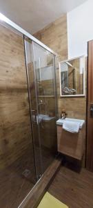 a bathroom with a shower and a sink at Penzion Svojanov in Svojanov