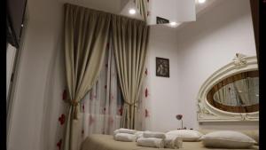 a bedroom with two beds and a large mirror at VLAD&ELISA in Bacău