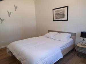 Postel nebo postele na pokoji v ubytování Le Logis de Gatseau