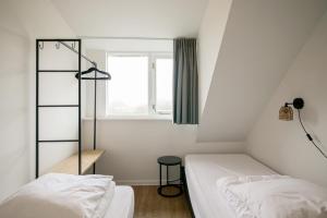 Postel nebo postele na pokoji v ubytování De Duintuin - In de duinen! - Groote Keeten