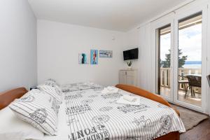 Posteľ alebo postele v izbe v ubytovaní Apartments Villa White House