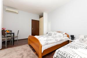 Posteľ alebo postele v izbe v ubytovaní Apartments Villa White House