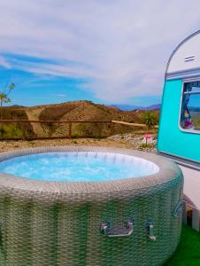 a hot tub in front of a rv at Tropical Dreams Motril in Los Tablones