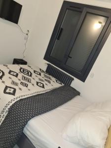 Postel nebo postele na pokoji v ubytování Chambre privée
