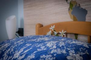 Postel nebo postele na pokoji v ubytování B&B LA MIMOSA E IL GELSOMINO