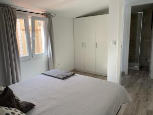 A bed or beds in a room at Atico Casa Mari